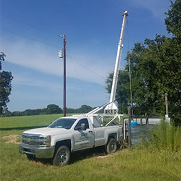 Truck with Crane over a Well